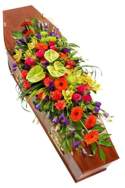 Bright colourful coffin spray