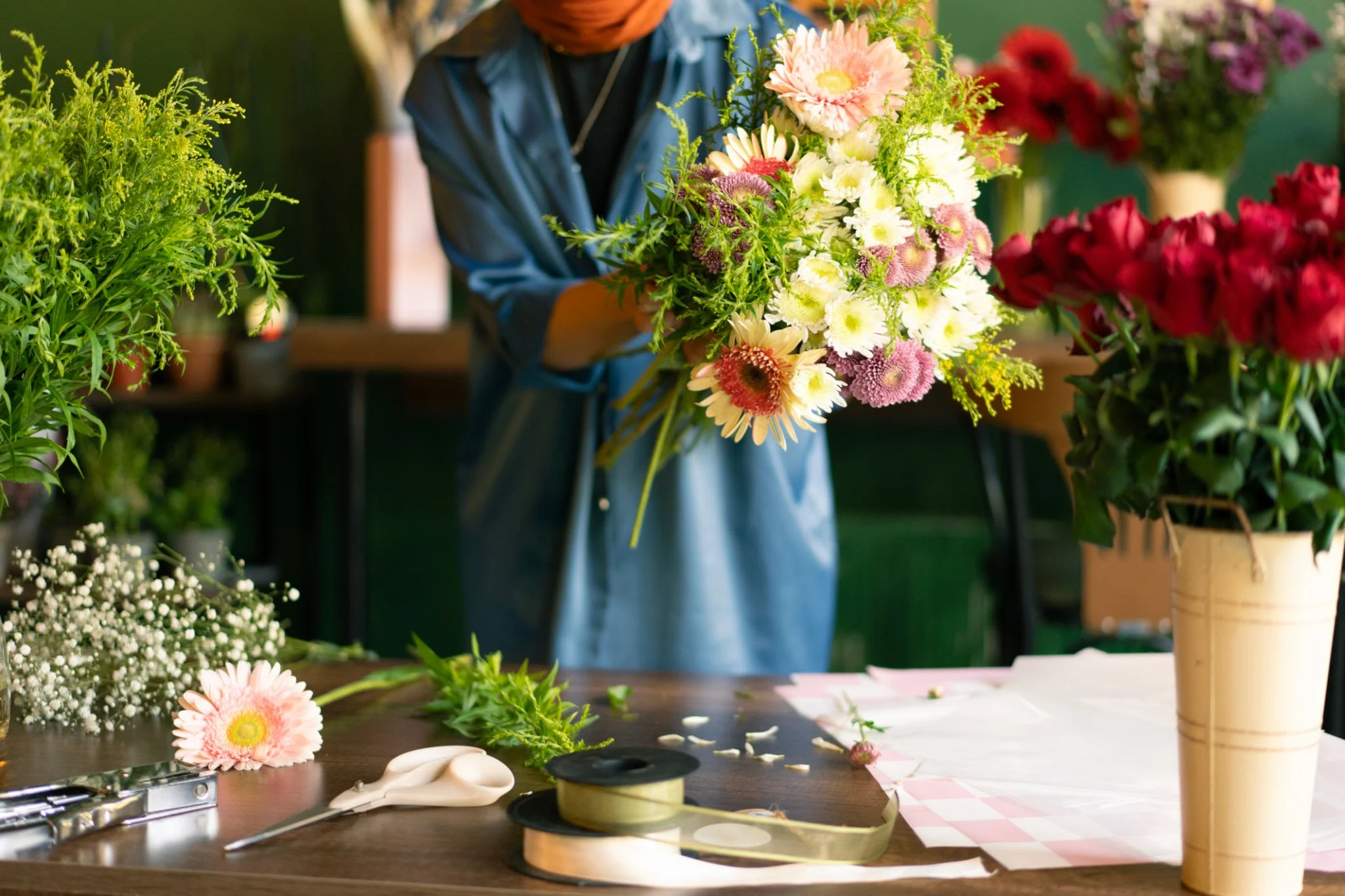 Florist preparing seasonal flowers