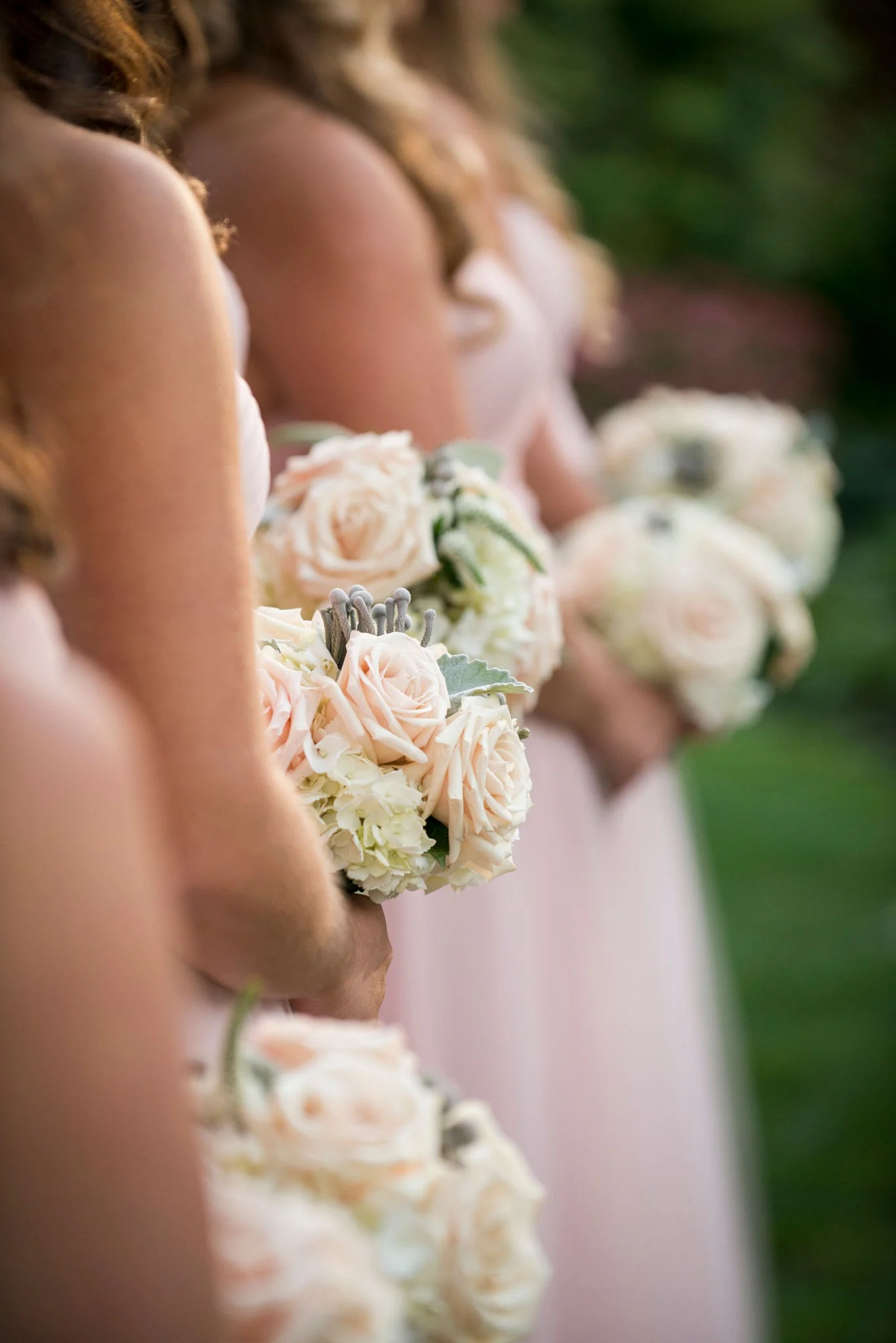 Blush bridesmaids with bouquets