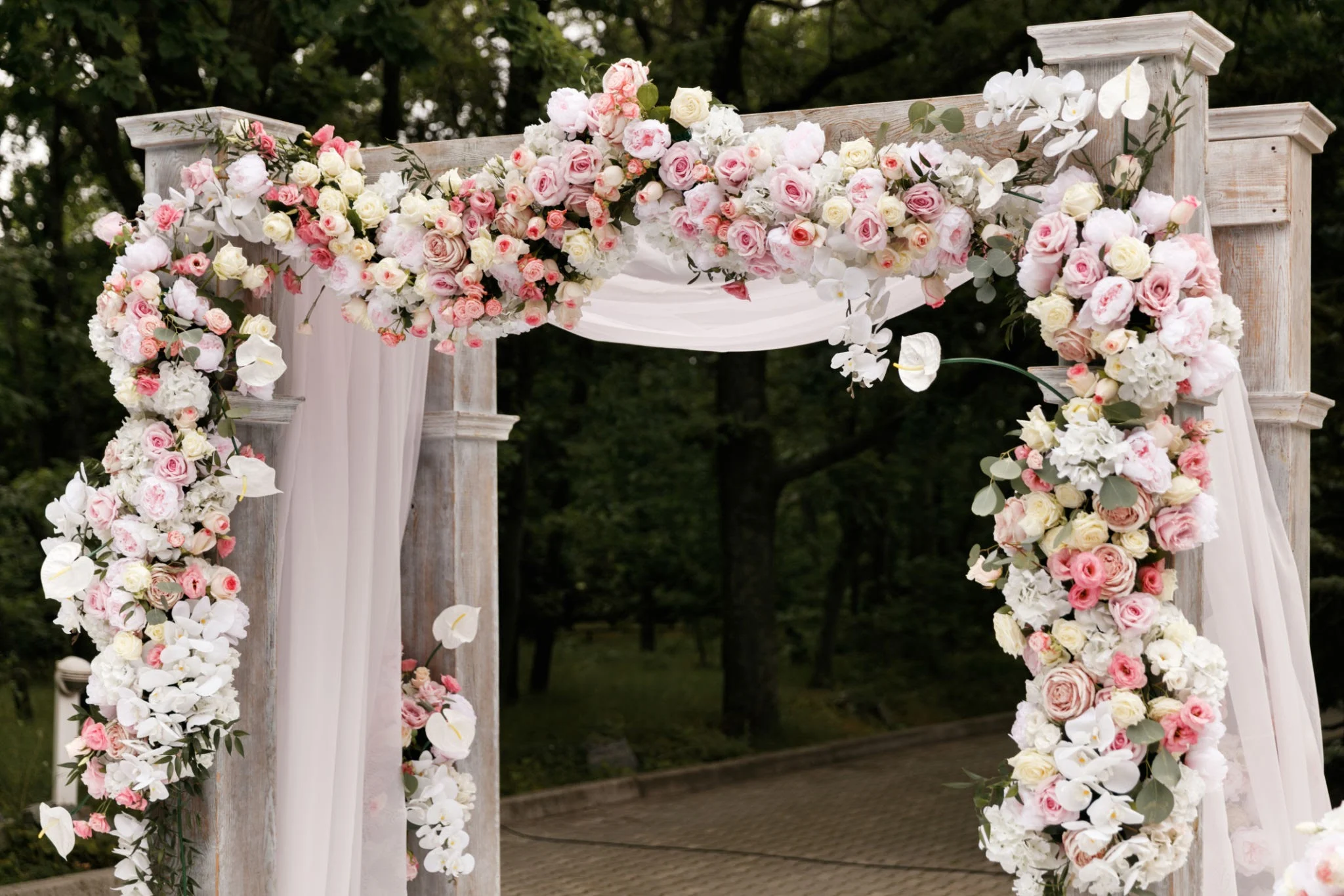 Ceremony arch with pastel flowers