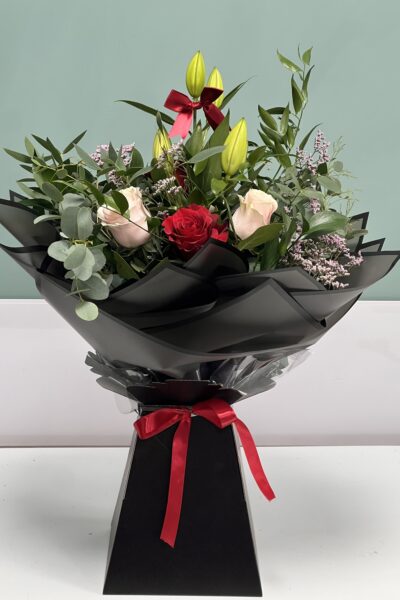 Red and pink rose and lily bouquet