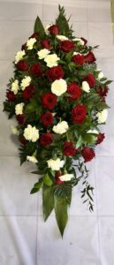 Rose and carnation coffin spray delivery to Holcombe